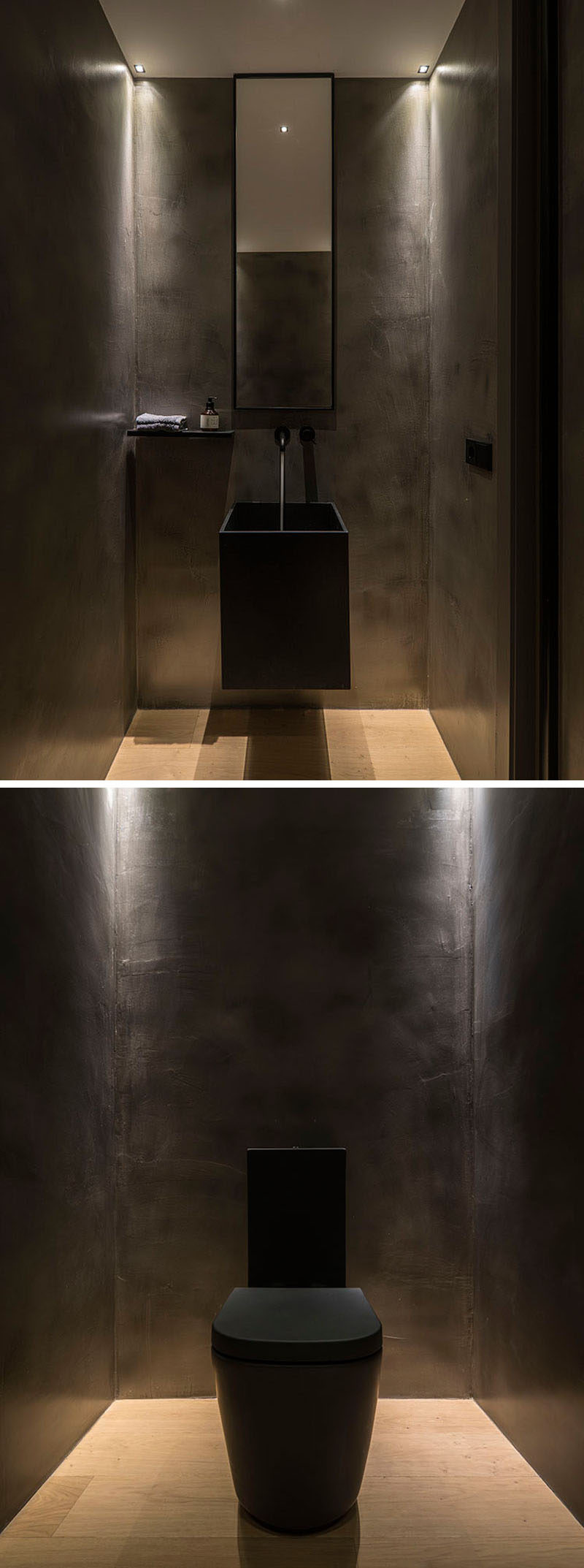 Inside this modern powder room, the walls, sink and toilet have been kept dark, creating a dramatic atmosphere,