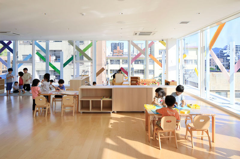 Colorful 'branches' on the exterior of this modern kindergarten can be seen from the interior.