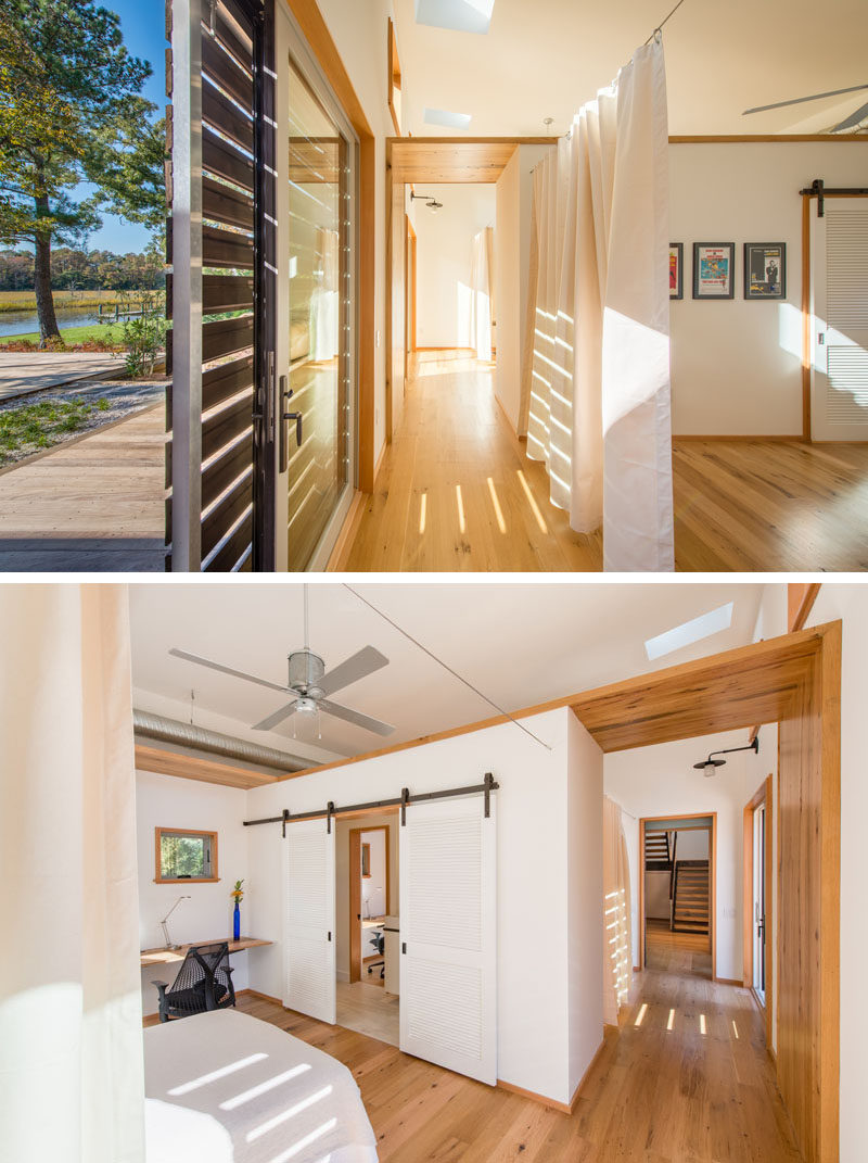 Some of the bedrooms in this modern home are closed off by the use of curtains. 