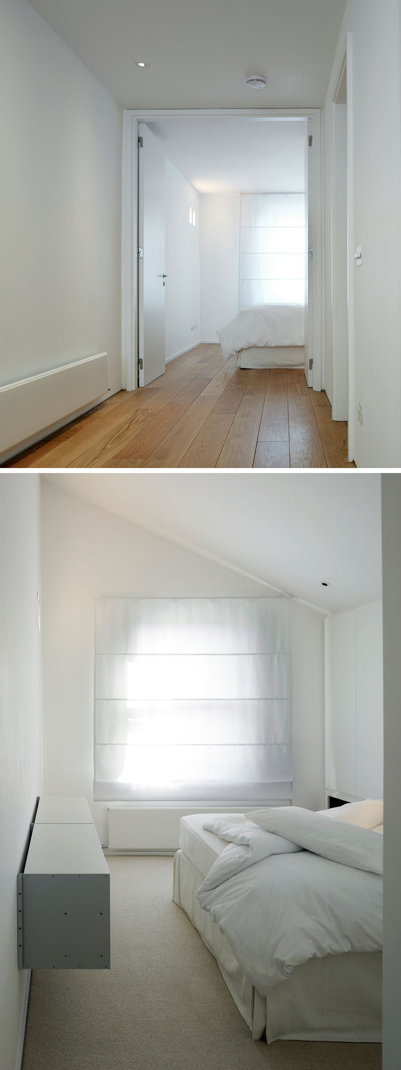 At the top of the stairs in this renovated house, there's a white themed bedroom. A simple window shade creates privacy but also ties in with the overall white appearance of the room.