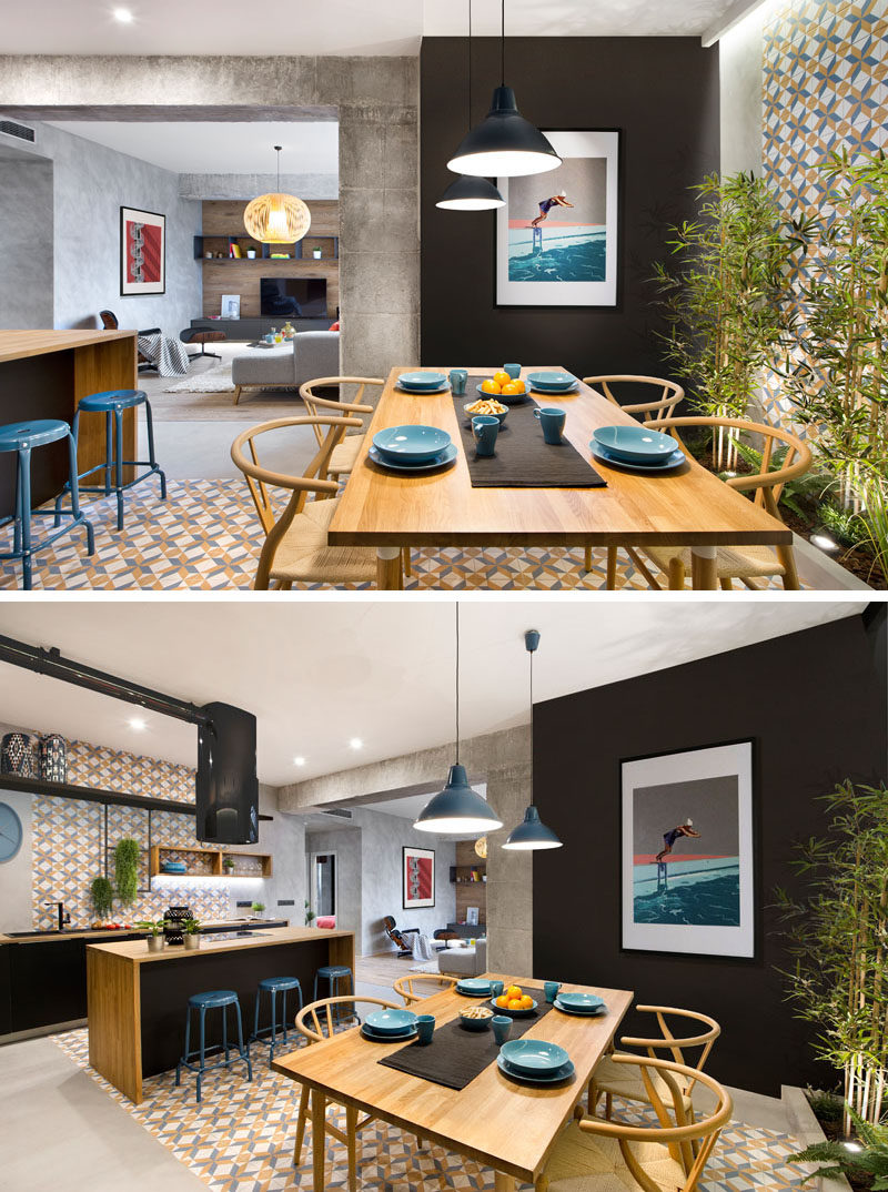 Stepping inside this modern rental apartment, you enter straight into the dining room. Colorful patterned tiles that wrap around from one wall to the other define both the dining room and the kitchen.