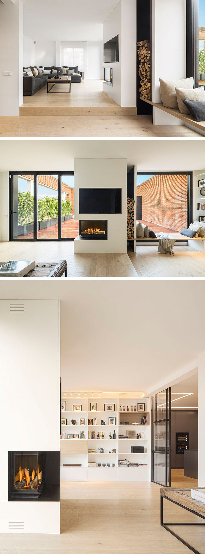 Inside this modern penthouse, the interiors of the home are bright with white walls that contrast the darker elements, like the furniture, fireplace and door frames. A wall of built-in shelving provides a place to display books and decorative pieces.