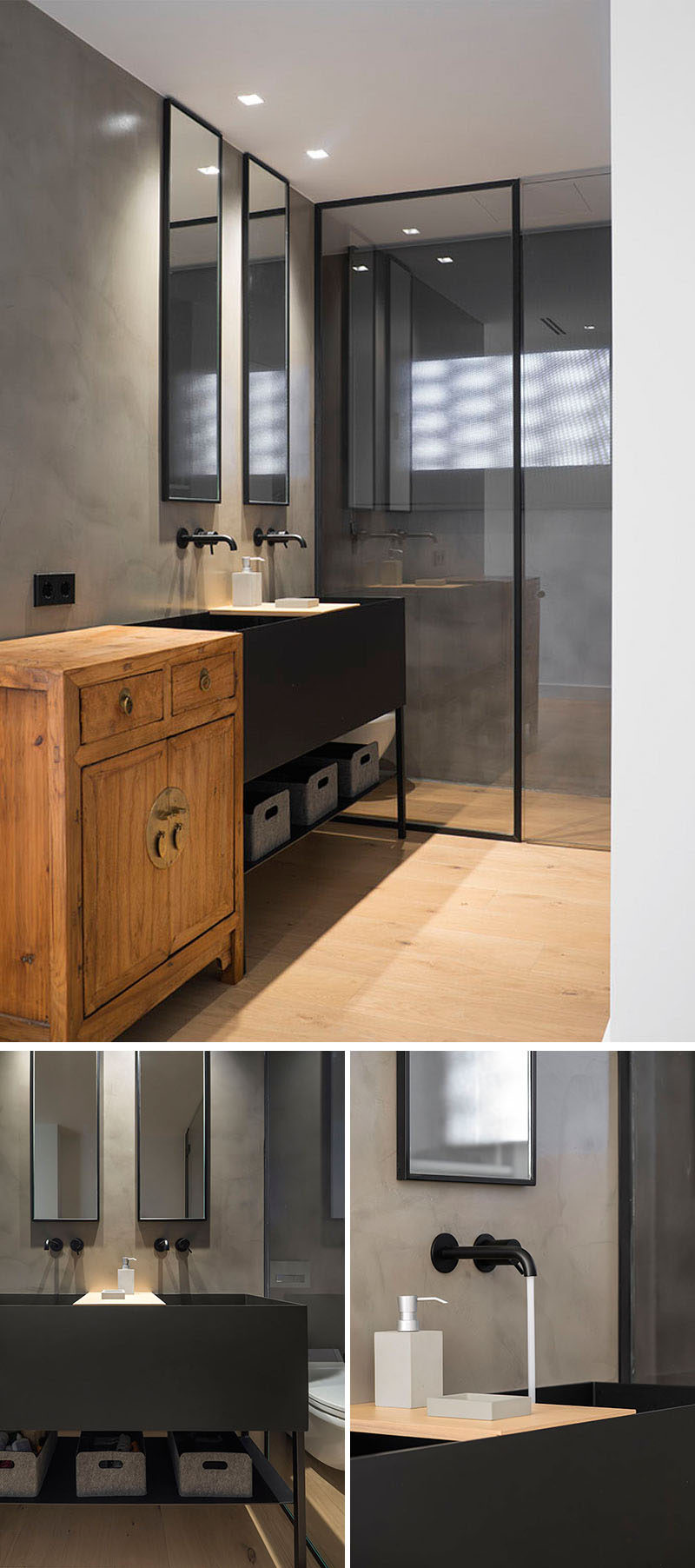 This modern bathroom has a black framed, glass enclosed shower and a vanity area with two rectangular mirrors mounted above the large dual-faucet sink.