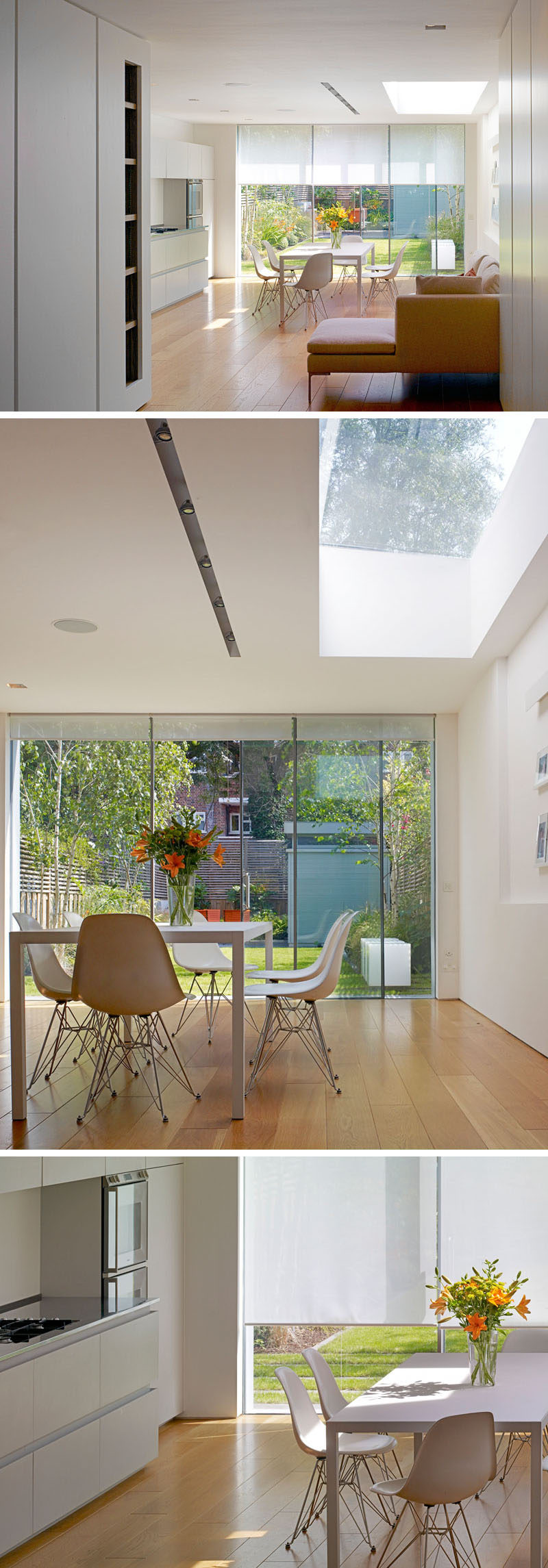Inside this renovated house, the kitchen and dining area features simple white matte emulsion walls. The bespoke kitchen with white hardware free cabinets features a long stainless steel worktop made in Italy by Foster. Recessed Viabizzuno lighting has been added in the ceiling to create a seamless finish.