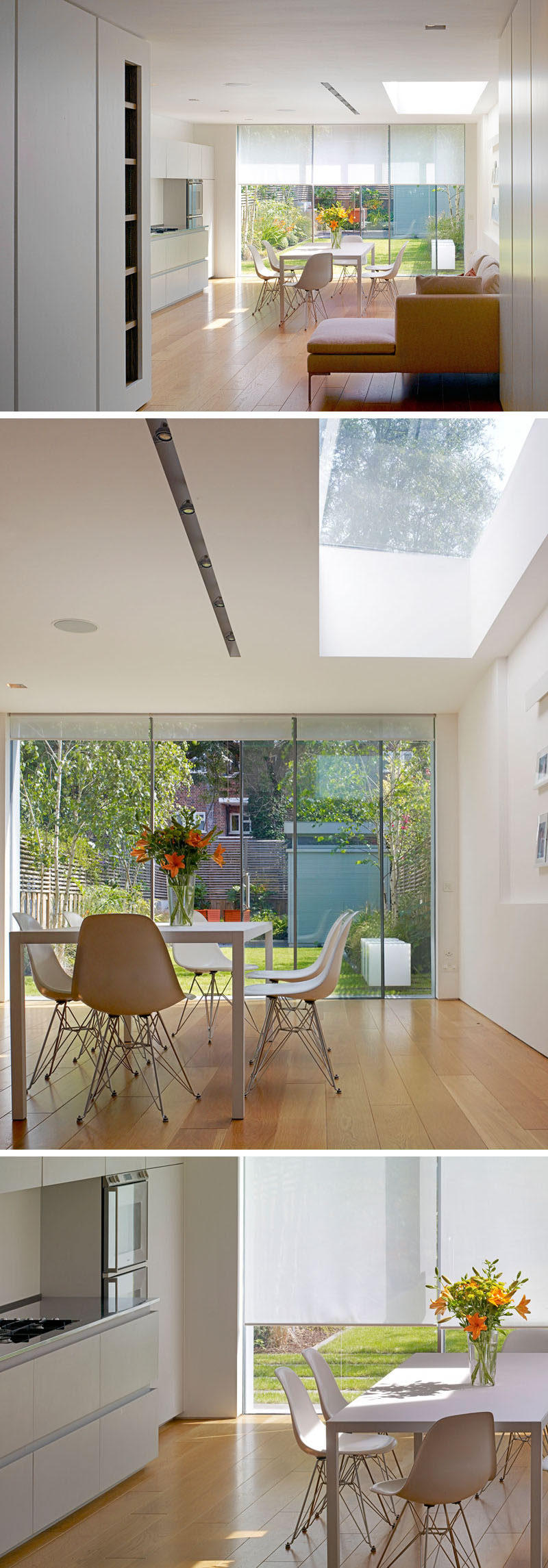 Inside this renovated house, the kitchen and dining area features simple white matte emulsion walls. The bespoke kitchen with white hardware free cabinets features a long stainless steel worktop made in Italy by Foster. Recessed Viabizzuno lighting has been added in the ceiling to create a seamless finish.