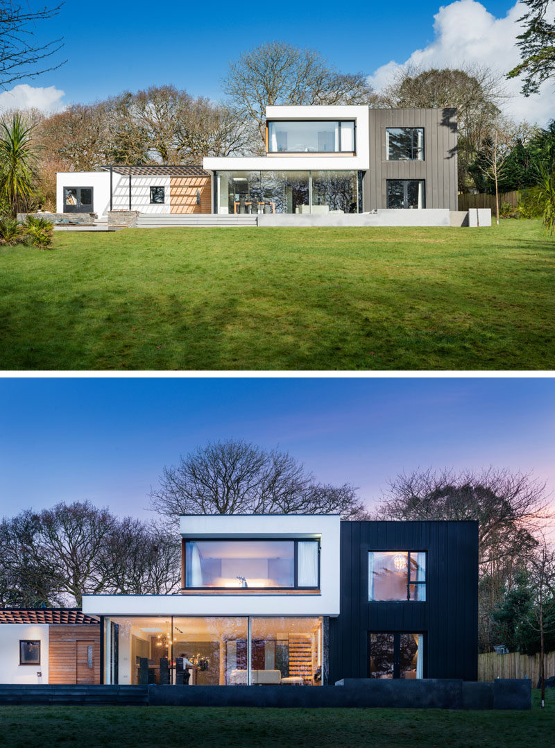 The rear of this modern home has a large patio that runs the length of the house.