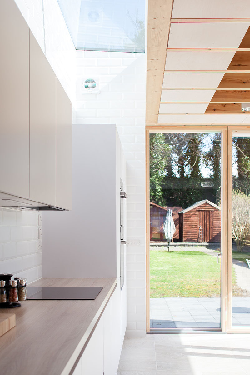 Large floor to ceiling windows and a glass door were used in this modern house extension to fulfill the clients requests to see their garden and to have a bright space.