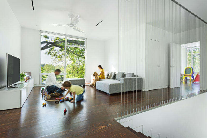 This modern house has a family room with views of the landscape. High ceilings keep the loft-like feeling that the owners wanted.