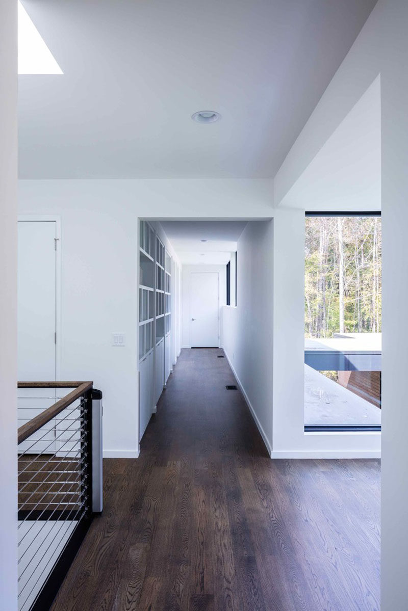 Dark oak floors have been featured throughout this modern house to add a touch of warmth to the interior.