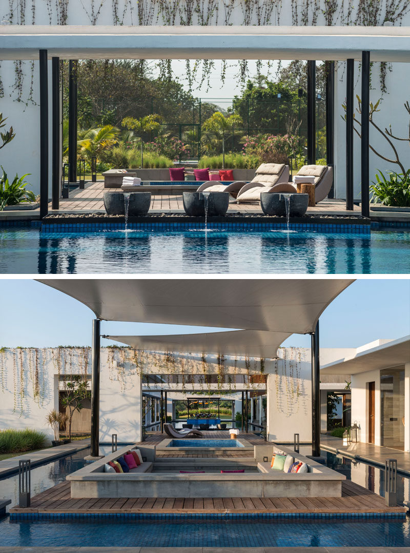 This modern house has an outdoor hot-tub and sunken lounge area, that's surrounded by a water feature.