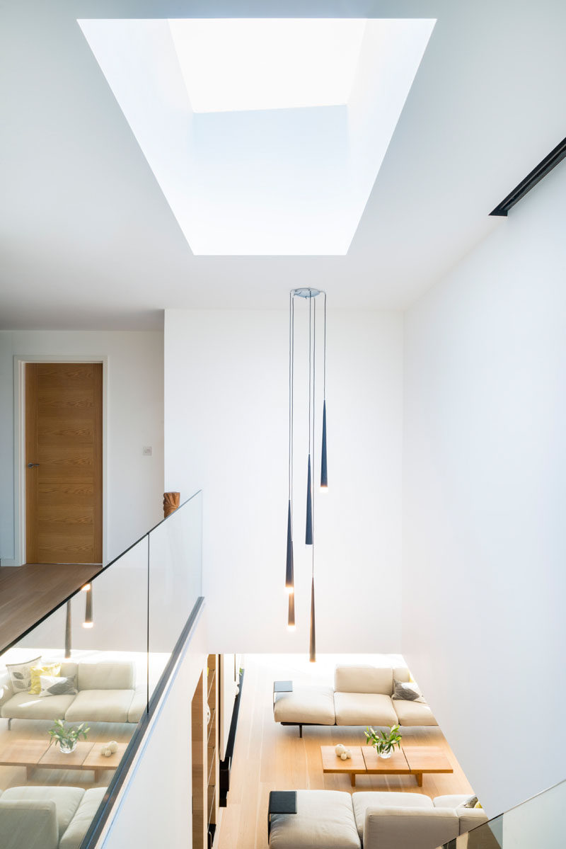 At the top of these modern stairs is a skylight that fills the space below with natural light.