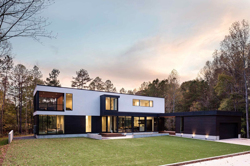 Architecture firm in situ studio, have designed a new modern house that's surrounded by the forest and overlooks a pond in Matthews, North Carolina.