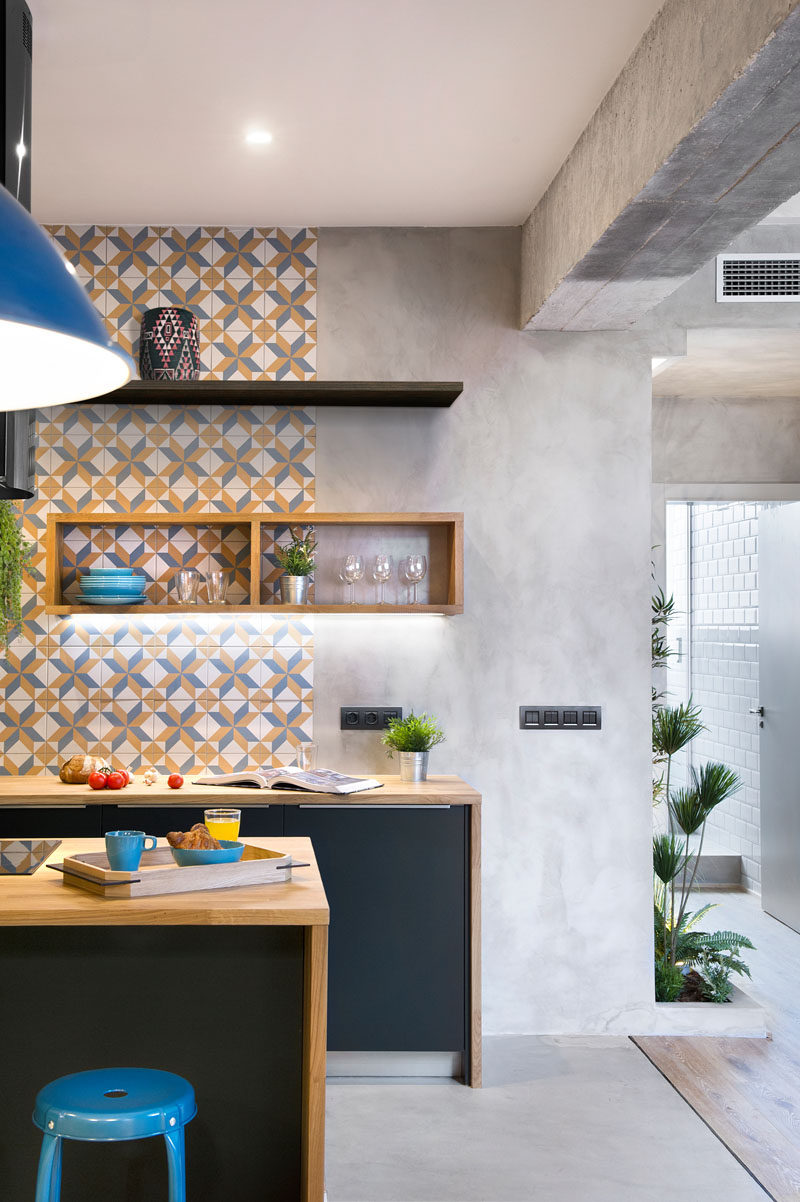 Apart from tiles and wood, the remainder of the walls in this modern apartment are concrete and help to create an almost industrial feel.