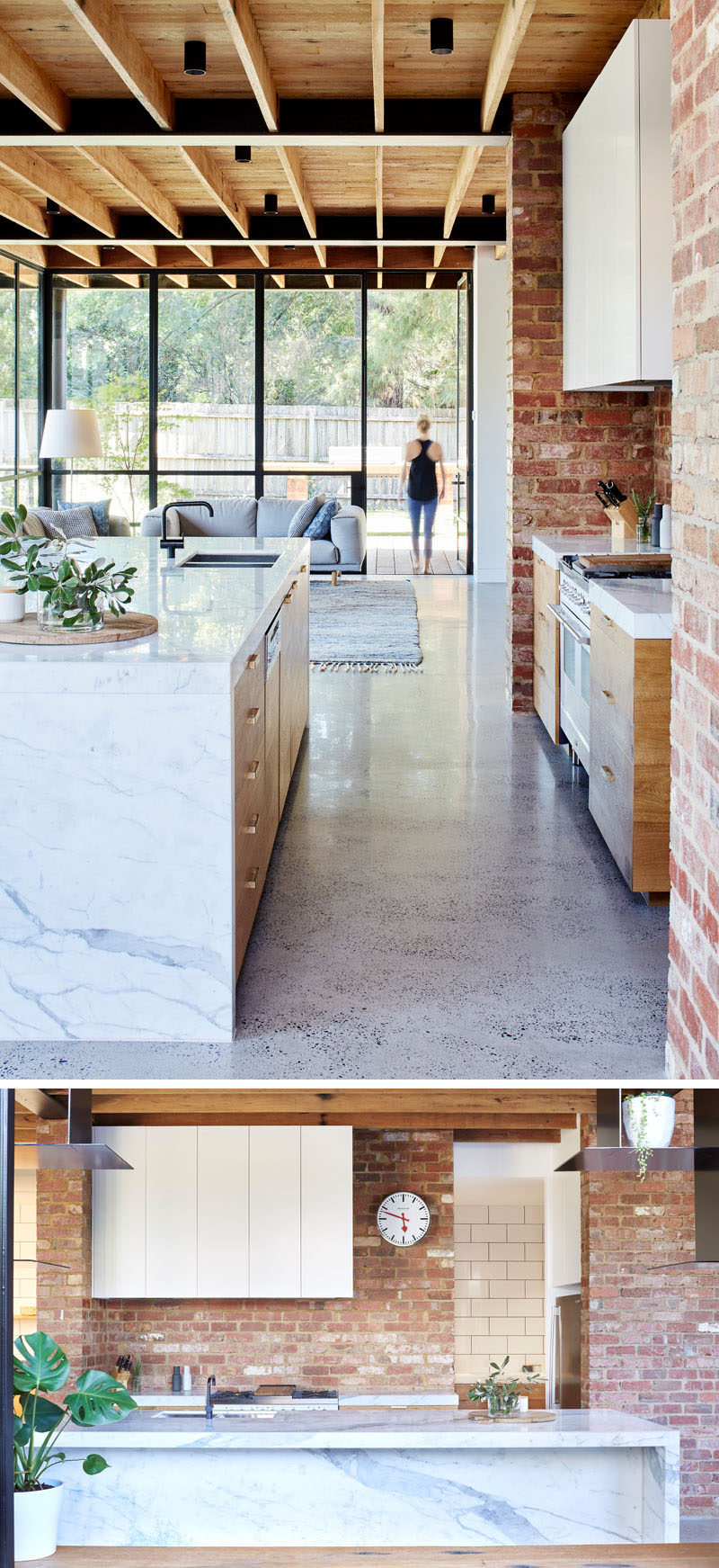 In this modern kitchen, red brick, some of which was recycled from the garden paving, covers the wall and compliments the timber paneled cabinet doors and the Statuario marble used for the countertops and island.