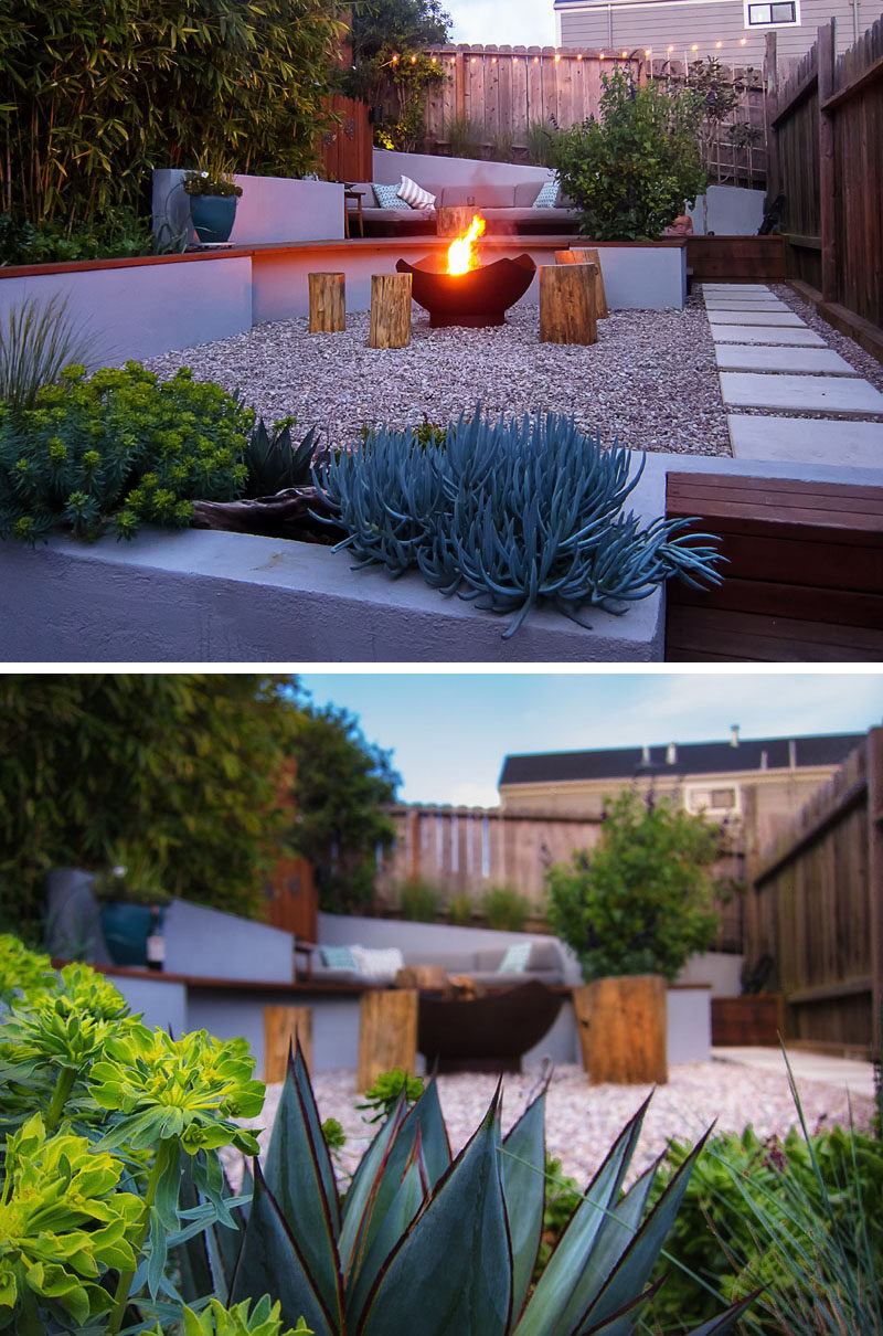 This modern landscaped backyard has a raised outdoor lounge deck, a wood burning firepit, succulents, bamboo and a vegetable garden.