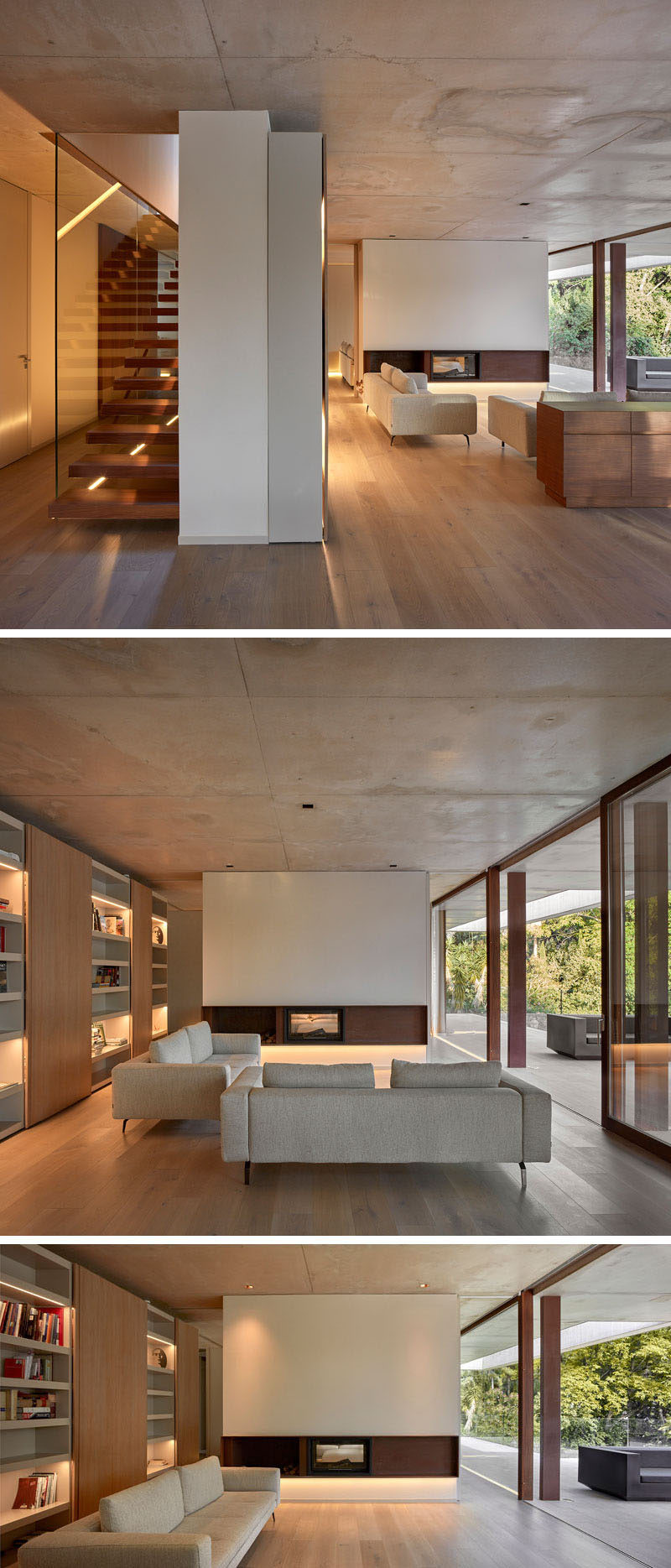 Stepping inside this modern house, the living room with wood flooring and a concrete ceiling, has a minimalist fireplace and a wall of shelving with highlighted sections to display personal items.