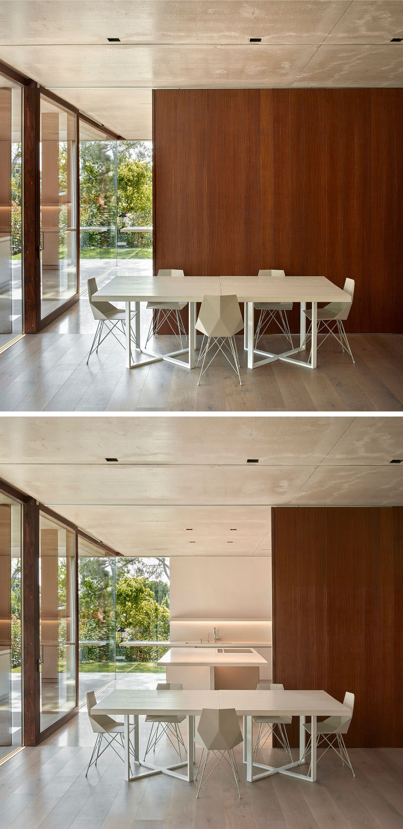 This dining room is minimal in its design with white table and chairs, while a wood wall slides open to reveal the kitchen behind it.