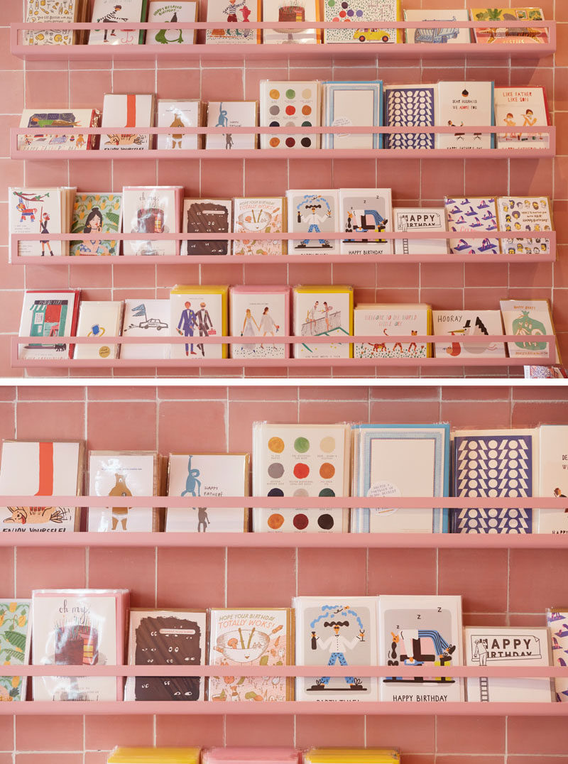In this modern retail store, this greeting card display is colored the same as the dusty pink tiles, almost blending into the walls.