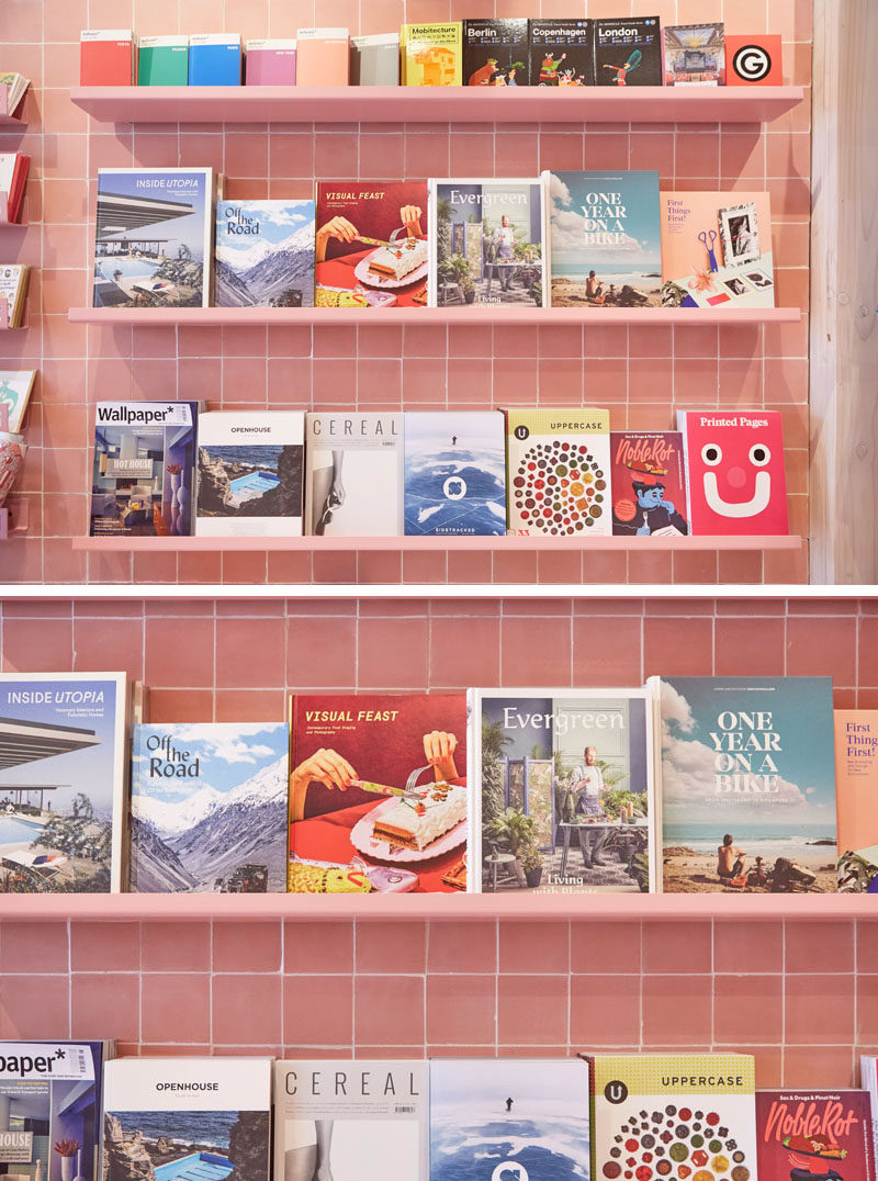 In this modern retail store, dusty pink floating shelves match the tiles on the wall.