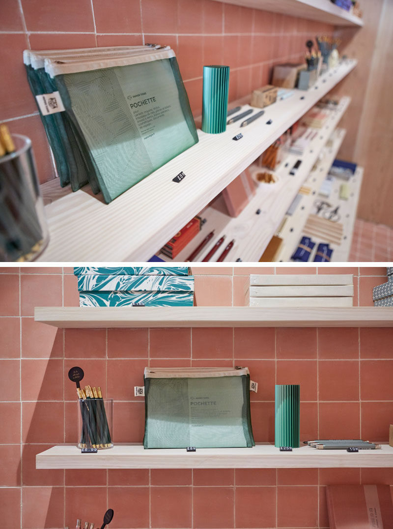 In this modern retail store, simple wood shelves add a natural touch, and allow for a variety of color-organized products to be displayed.