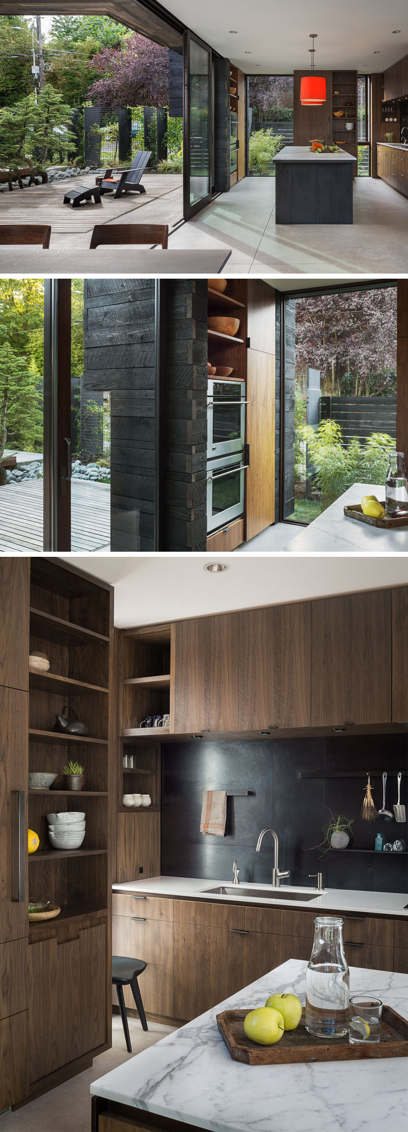 The glass walls of this modern house provide an abundance of natural light the kitchen that's located just off the courtyard. Custom walnut cabinetry has been designed to perfectly fit into the space, while marble has been used for the countertops.