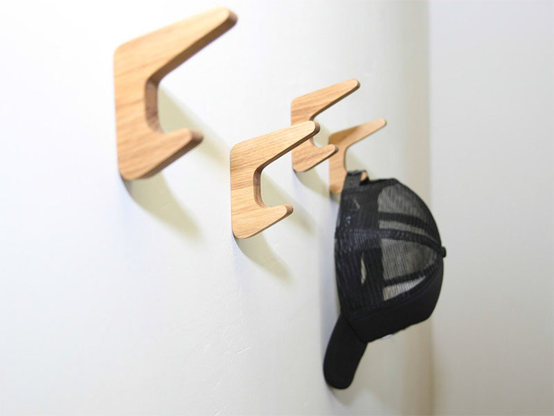 These simple wood wall hooks actually have two hooks, ideal for hanging both coats and bags on one hook.