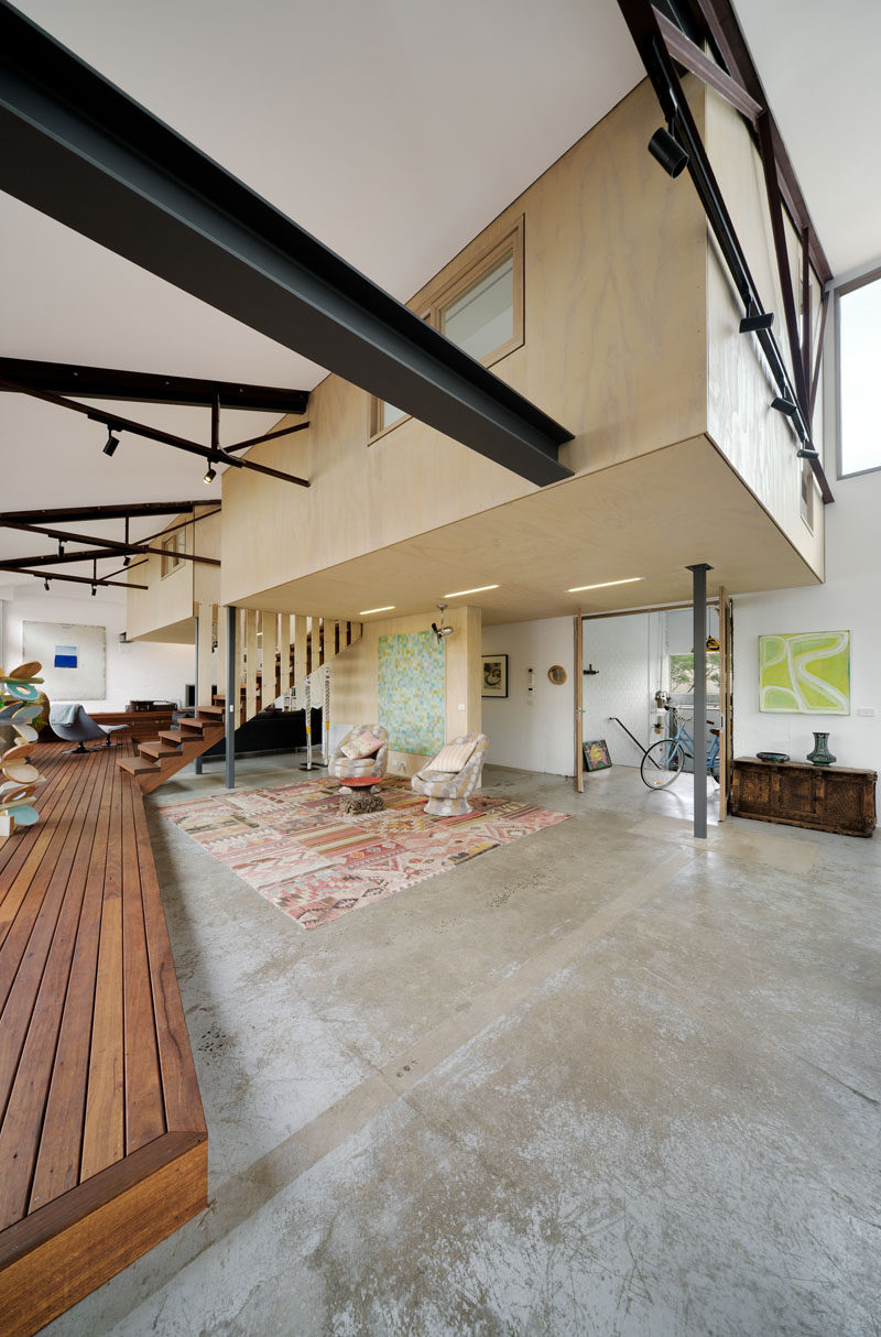 Throughout the main living level of this converted warehouse, the existing warehouse floor slab was kept, partially due to restricted site access, but also for its inherent embodied energy.