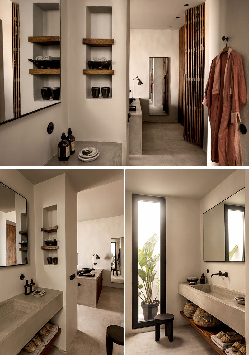 In this contemporary hotel bathroom, shelves have been built into the wall, while a concrete vanity sits above a wood slat shelf. #bathroom #InteriorDesign #ModernBathroom