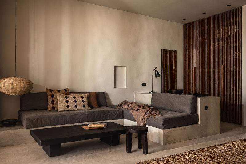 This contemporary hotel room in Greece features a couch that's been built into the room. #HotelRoom #Greece #Couch #BuiltInCouch #InteriorDesign