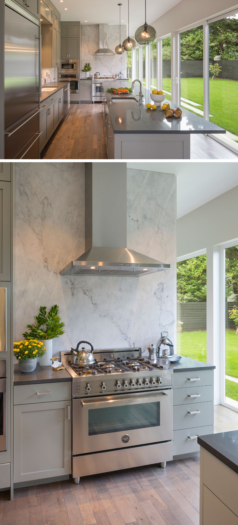 This contemporary kitchen features a large grey marble slab at the end of the kitchen is illuminated and becomes a backdrop that's visible from inside and out. A large kitchen island with a sink and plenty of storage, provides ample food prep space.