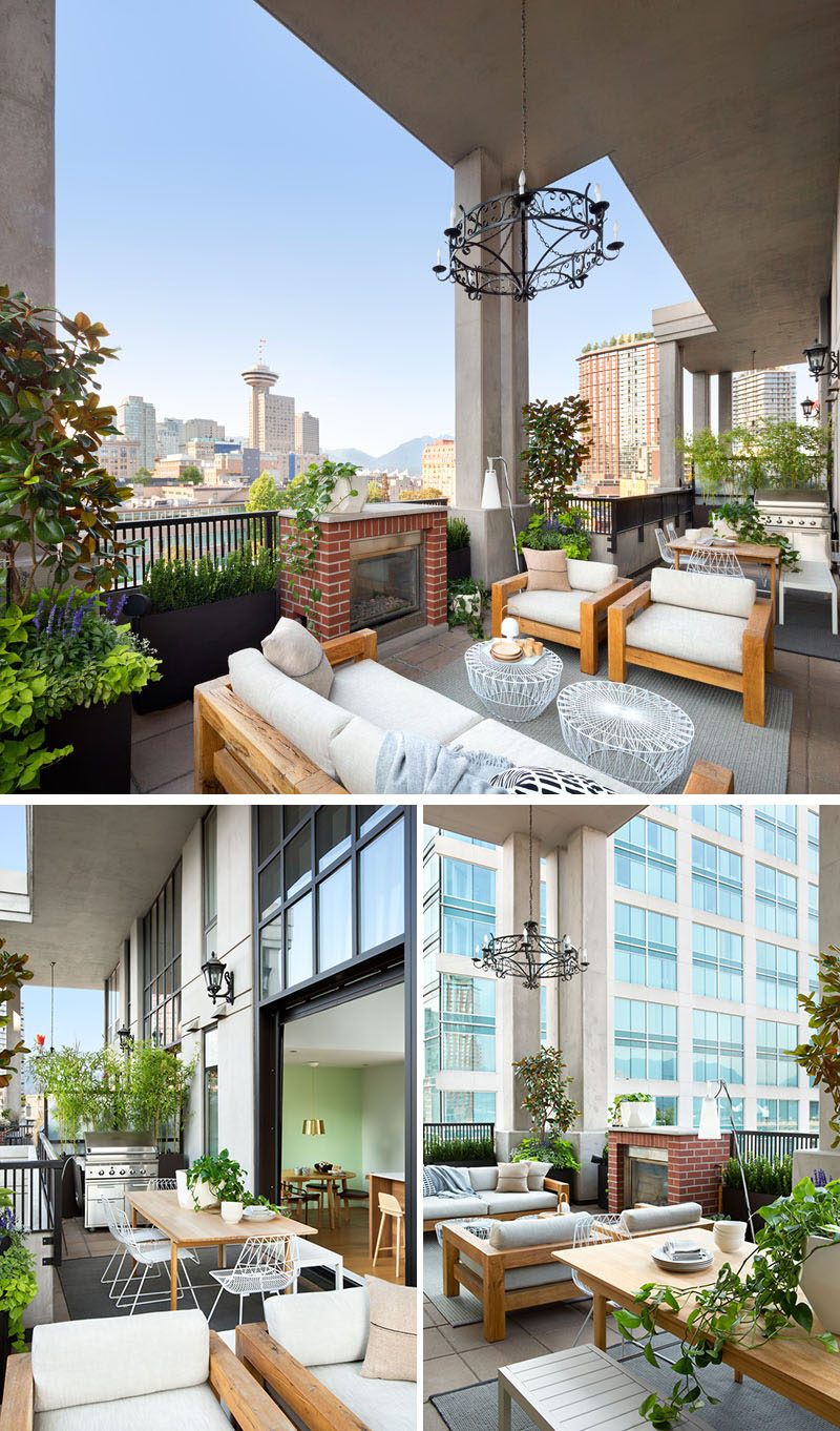 This modern loft balcony has views of downtown Vancouver, and is filled with a variety of places to relax or entertain. There's a bbq and outdoor dining area as well as a lounge area next to a fireplace. 