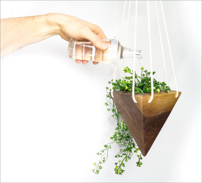 Fernweh Woodworking has created a collection of modern, geometric hanging wood planters, made from solid pieces of real wood.