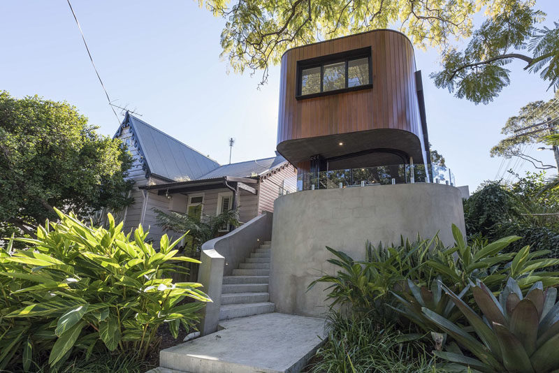 This modern curved wood and concrete house is located in Sydney, Australia, and features indoor/outdoor living. #Architecture #Australia #Landscaping #Wood #Concrete