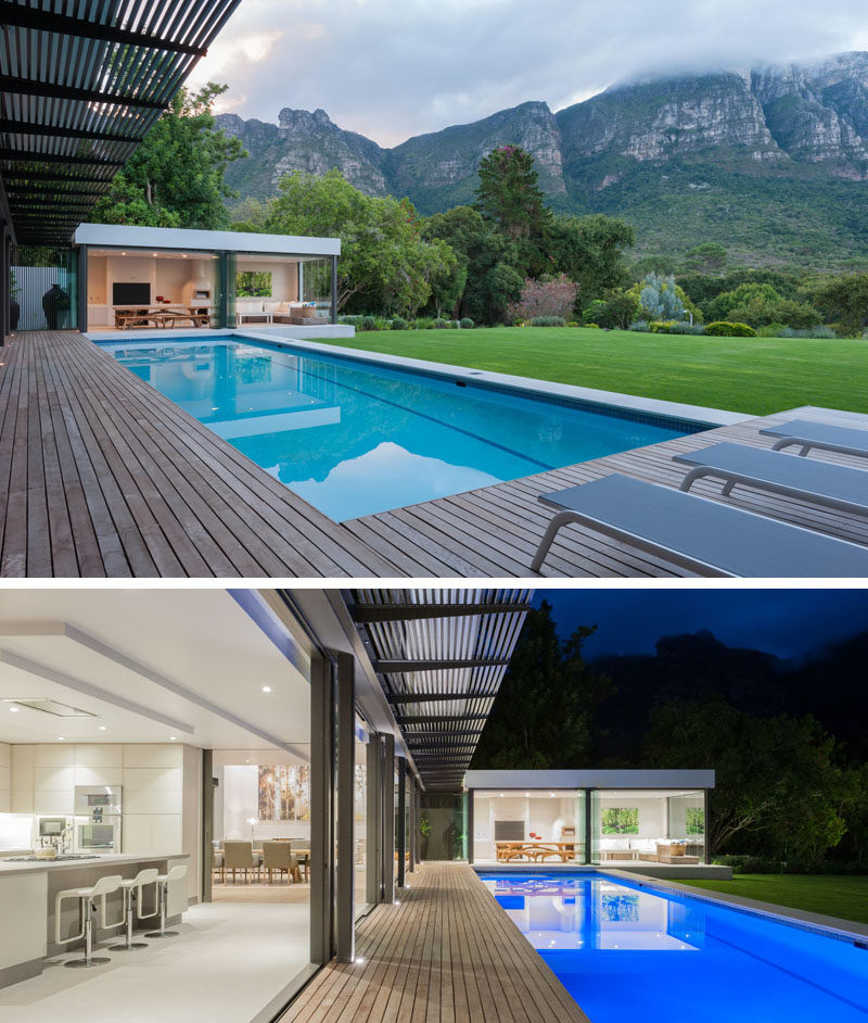 This modern house has expansive uninterrupted mountain views. At the end of the swimming pool is a small pavilion that houses a casual living room and dining area.