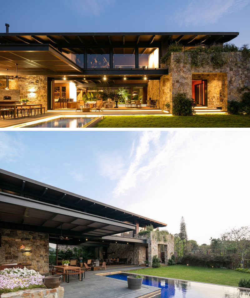 The main living level of this modern house can be opened to the backyard and swimming pool. A wood deck with hidden lighting is home to a covered outdoor dining area and kitchen.