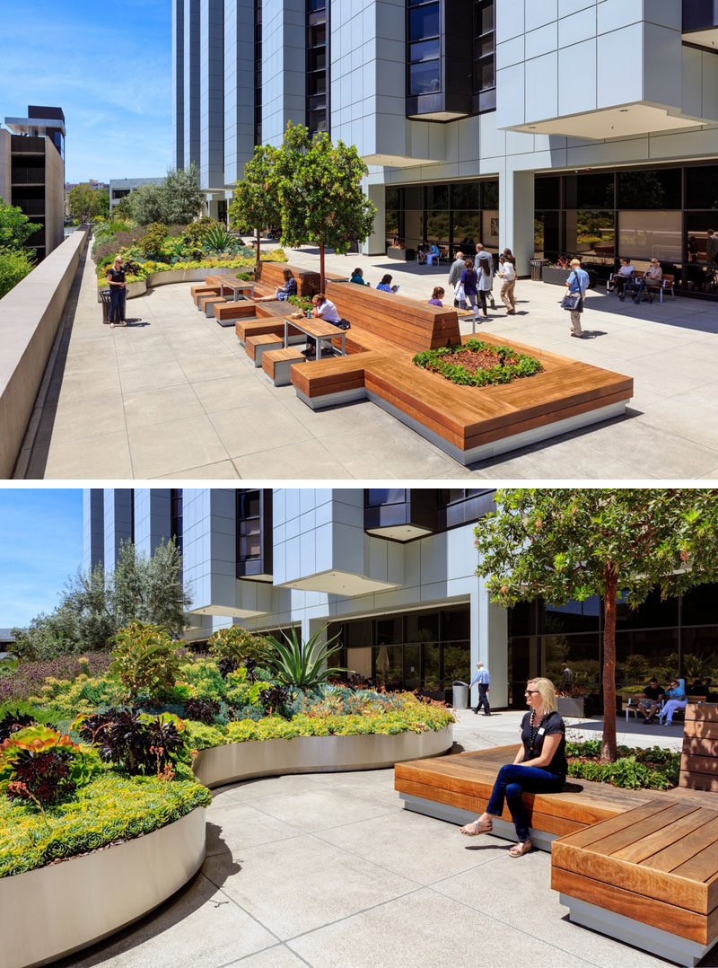 This healing garden at a medical center has wood benches with built-in planters allowing for communal seating and places for employees to have their break.