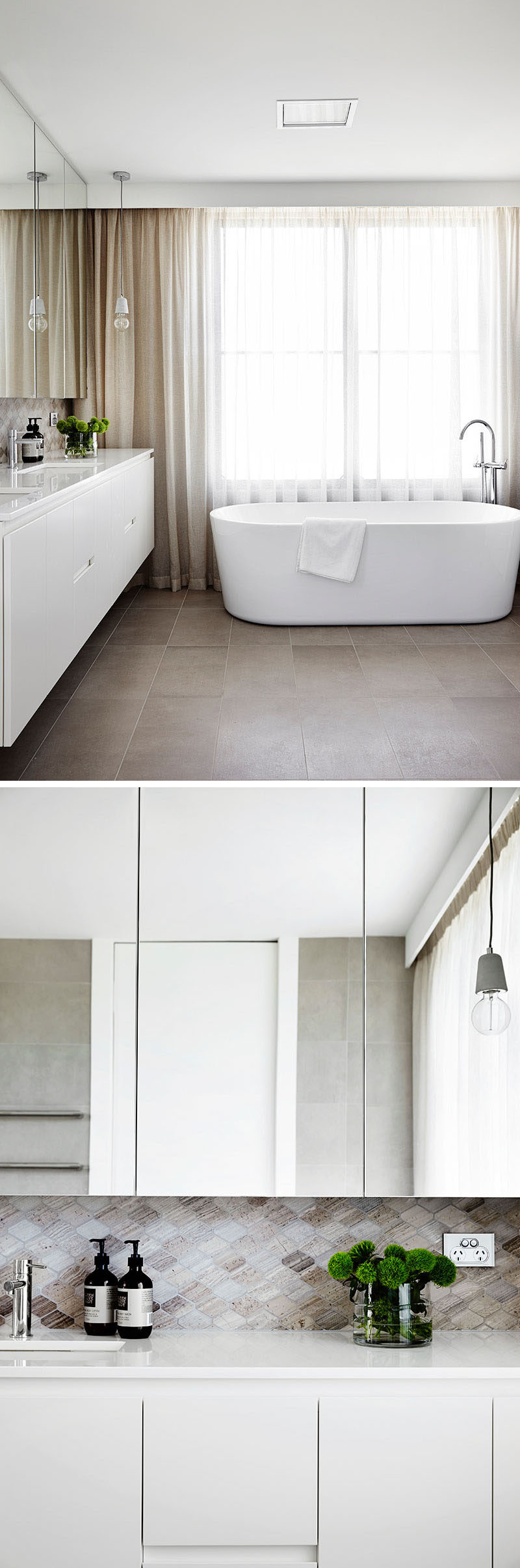 In this modern ensuite bathroom, a large window adds plenty of natural light and the mirror helps to bounce that light around the room. A tile backsplash in natural colors compliments the curtains and flooring.