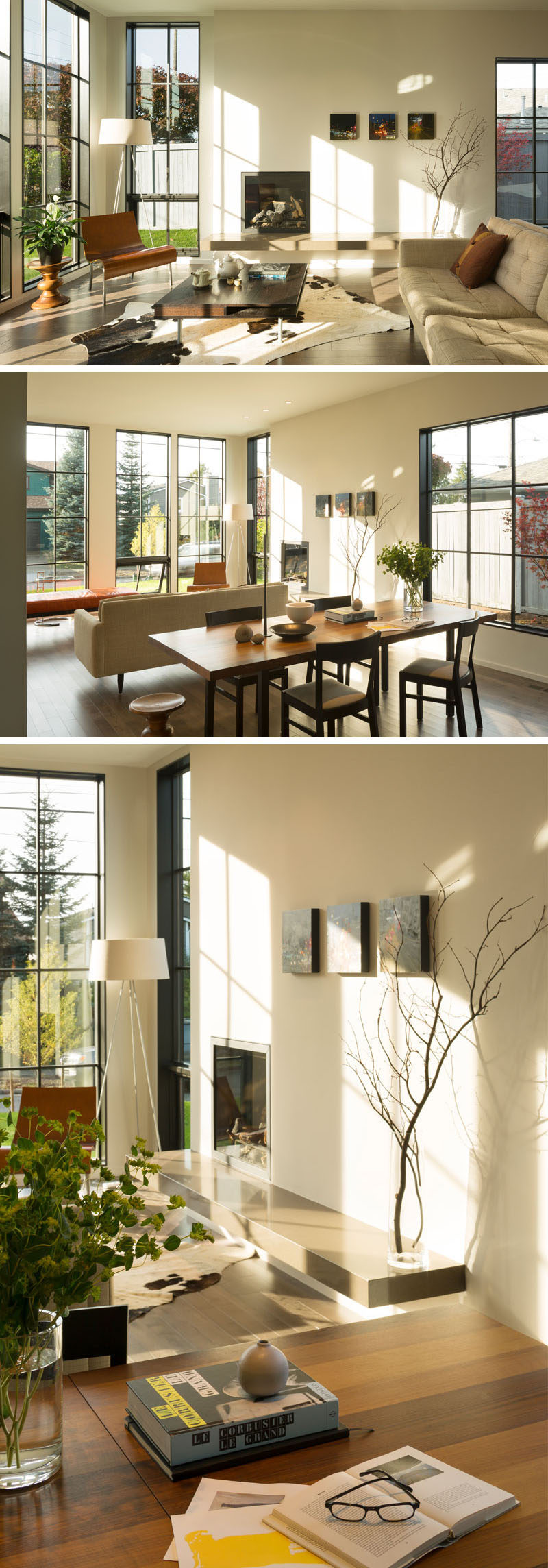 Stepping inside this contemporary home, the large grid windows flood the interior with natural light and provide views out onto the street. The living room, located at the front of the house, is focused on a built-in fireplace, while behind the couch is the dining area with a wood dining table.