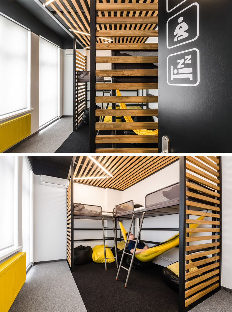 This modern office interior has a nap room where employees can take a quick rest in one of the beds or in the hammock. There's also a few bean bag chairs to relax and have some quiet time.