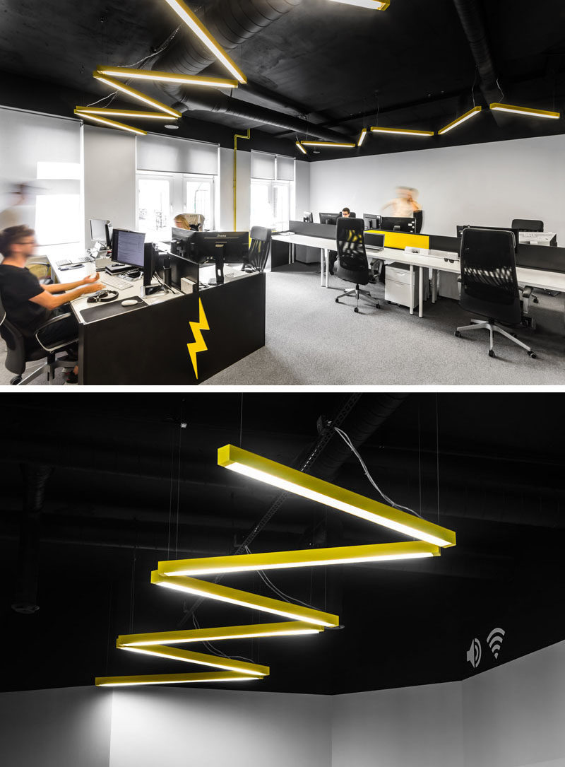 In this modern open plan work area, there's yellow lighting arranged in a zig-zag form that's a reference to the lightning bolt found in the company's logo.