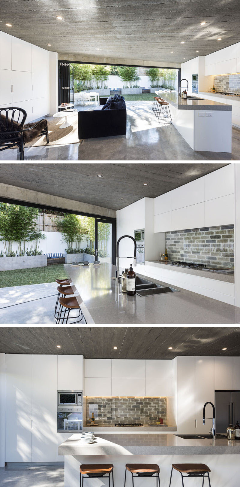 The interior of this modern house is bright and open, with the living room and kitchen sharing the same space. Minimalist white cabinets are featured on both walls, and in the kitchen a brick backsplash covered by glass has been used to create a unique accent. #ModernKitchen #WhiteCabinets #BrickBacksplash #ModernLivingRoom #OpenPlanInterior