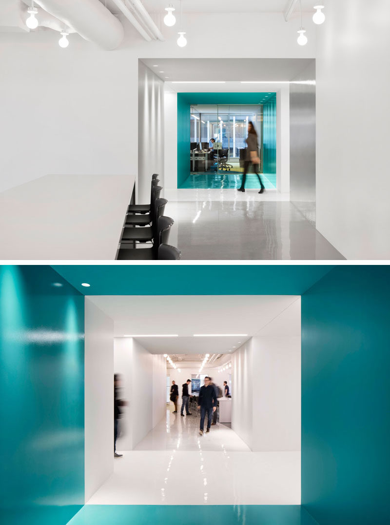 This contemporary and open-concept office design is mostly white, however bold pops of color have been used to define various areas throughout the interior. #Workplace #OfficeDesign #InteriorDesign #Office #Colors