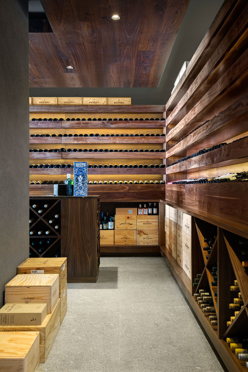 As this modern house is all about entertaining, there's a wine cellar, with wooden shelves specifically designed to show off the home owner's wine collection.