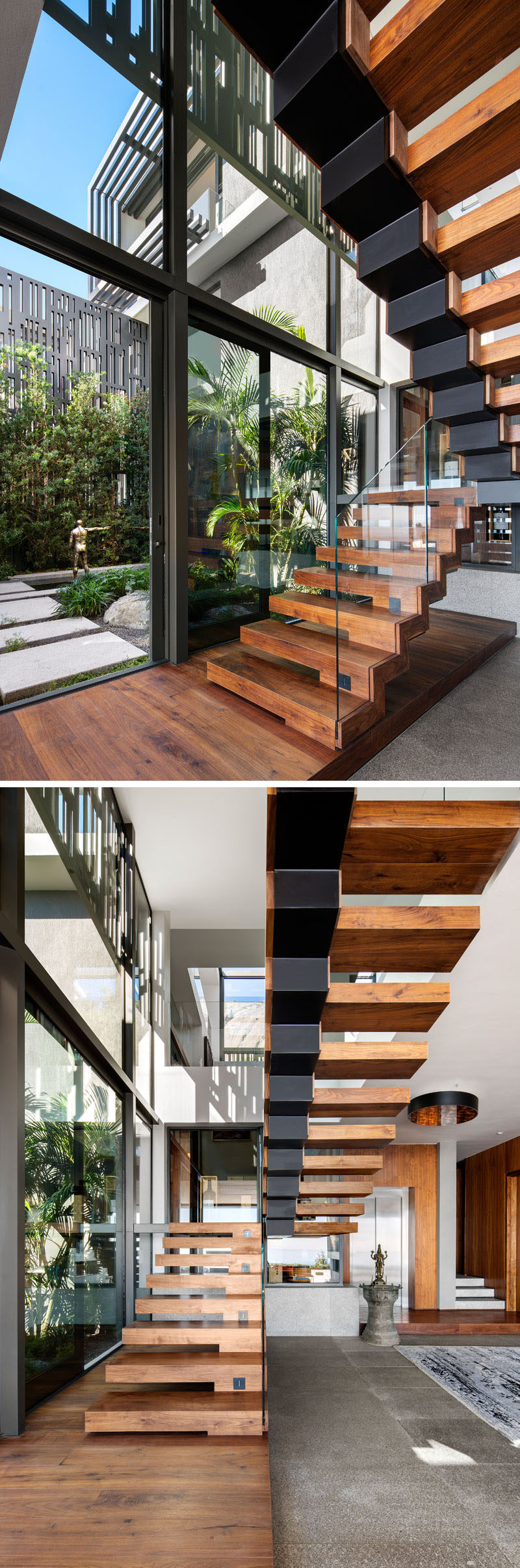 Modern wood and black metal stairs lead up to the upper floor of the home, while glass railings appear invisible and allow the view of the courtyard to be uninterrupted.