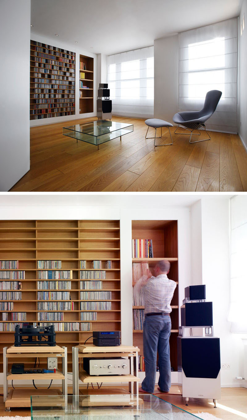 Custom shelves have been built into the wall in this music room and are lined with wood to make them stand out. #shelving #BuiltInShelving #WoodLinedShelving #WoodLinedBookshelf