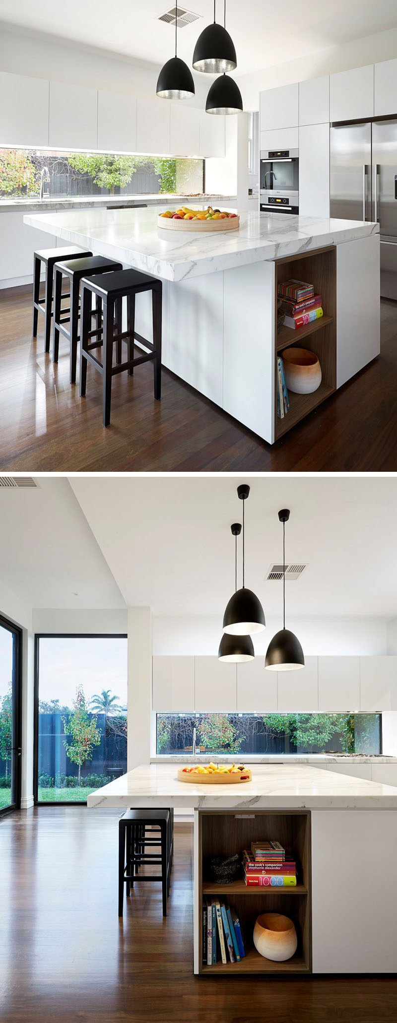 This white kitchen has wood built-in shelving in the kitchen island that's ideal for storing cookbooks. #WhiteKitchen #BuiltInShelves #WoodLinedShelves #KitchenIsland