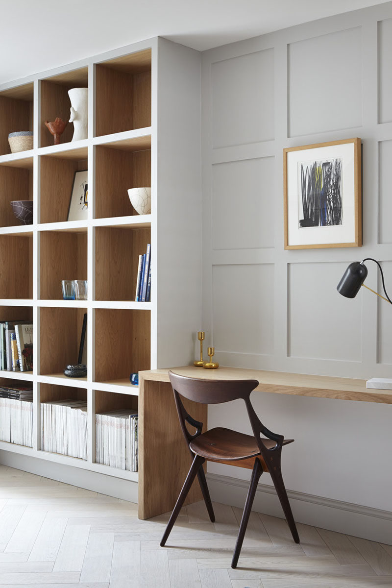 Each wood box in this built-in shelving unit has the front painted the same color as the wall to allow the wood to act as an accent. #shelving #BuiltInShelving #WoodLinedShelving #WoodLinedBookshelf