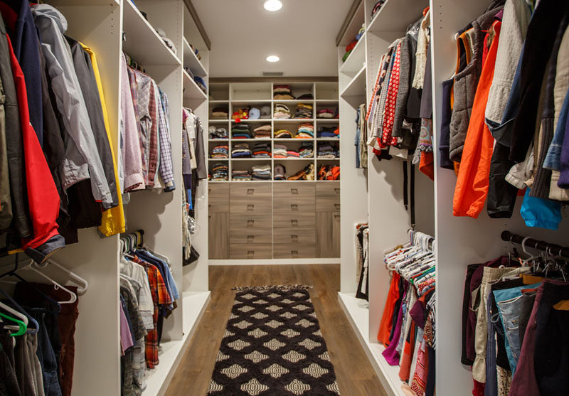 This large walk-in closet with floor-to-ceiling storage. #WalkInCloset #InteriorDesign #Closet #Storage