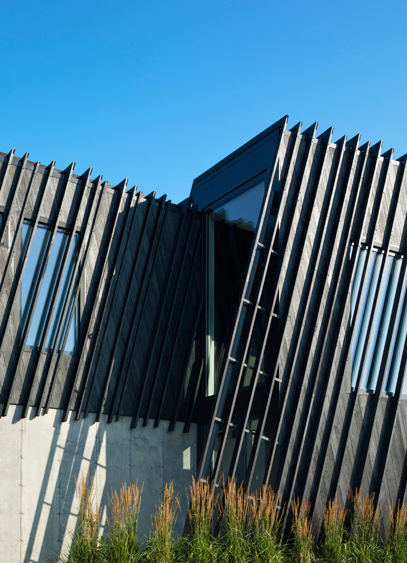 This modern house is covered in burnt wood siding called Shou Sugi Ban. #BlackSiding #ModernHouse #ModernArchitecture #ShouSugiBan