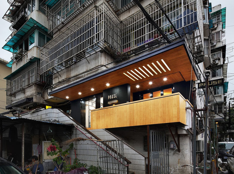 This modern coffee shop, full of matte black and bamboo elements, is nestled within a 1980s apartment building in China. #CoffeeShop #Cafe #ModernCoffeeShop #RetailDesign #InteriorDesign #Architecture